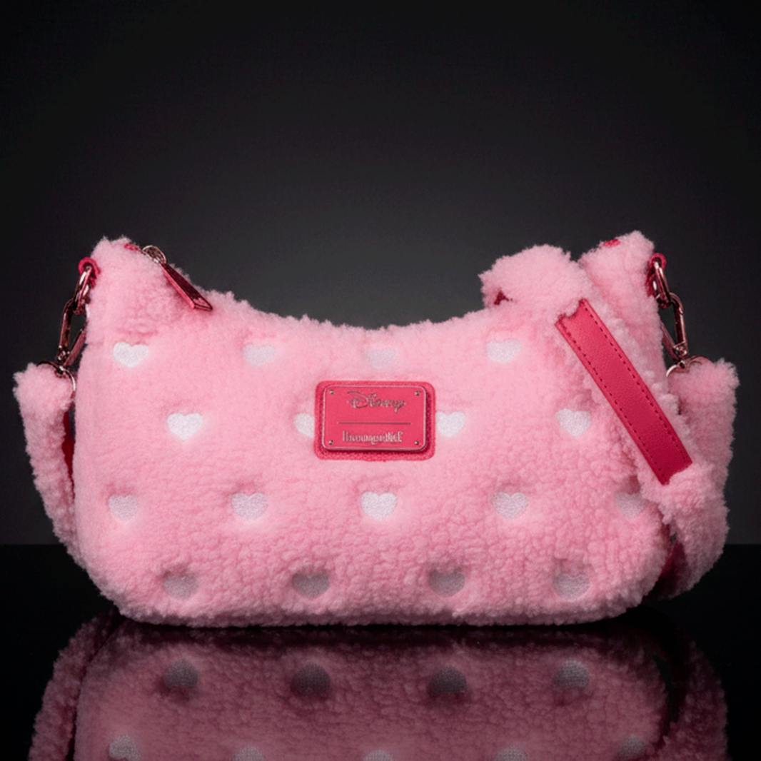 Loungefly pink sherpa crossbody bag with white heart accents and red leather details, Disney Minnie Mouse inspired design