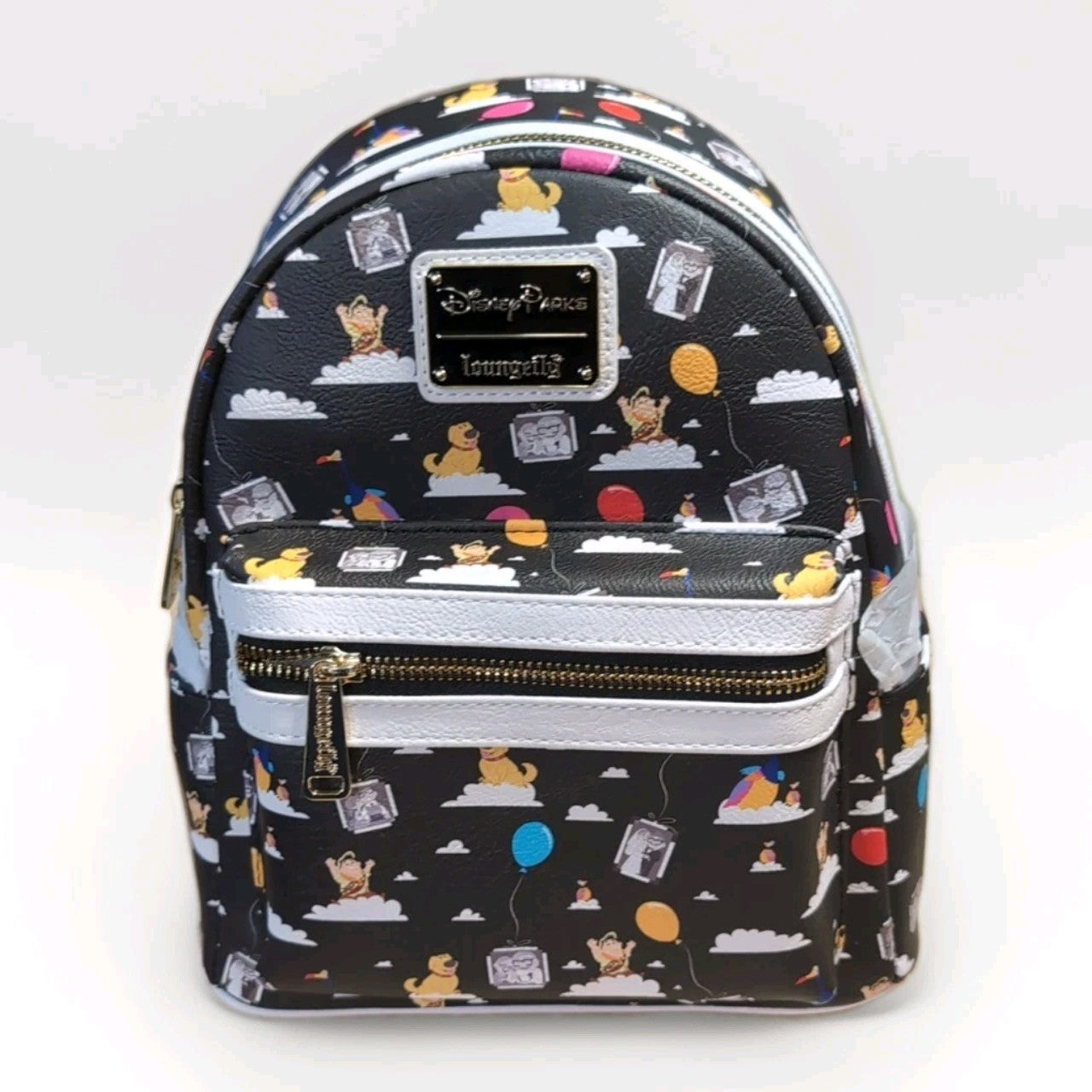 Loungefly black faux leather mini backpack with Winnie the Pooh characters and colorful balloons print