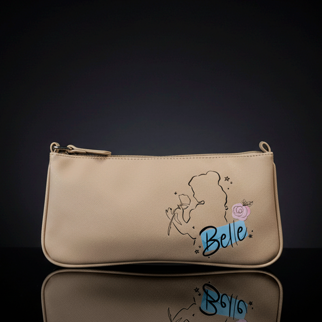 Danielle Nicole beige crossbody bag featuring Belle silhouette and rose graphic on smooth textured surface