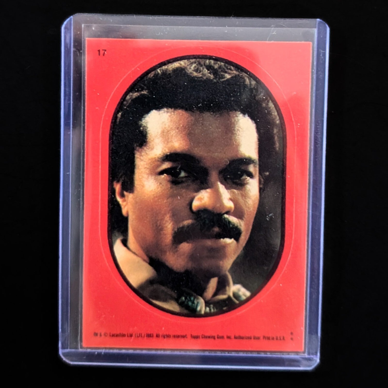 1983 Topps Return of the Jedi sticker card featuring Lando Calrissian in protective case from Go Figment