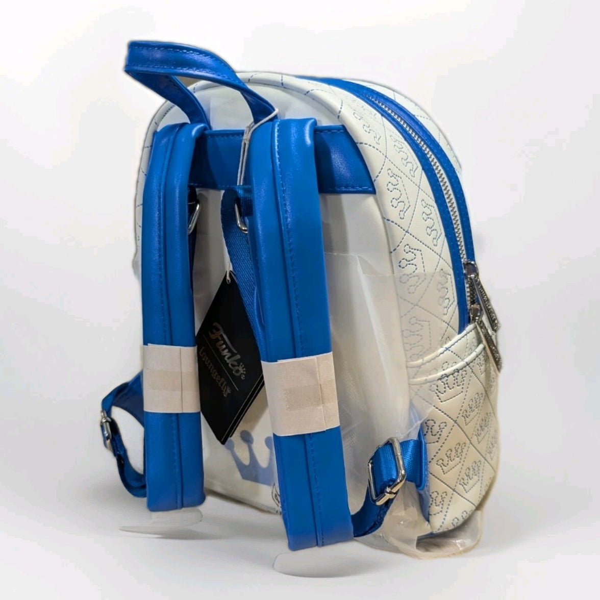 Loungefly mini backpack in white vegan leather with blue crown quilted pattern and padded blue straps side view