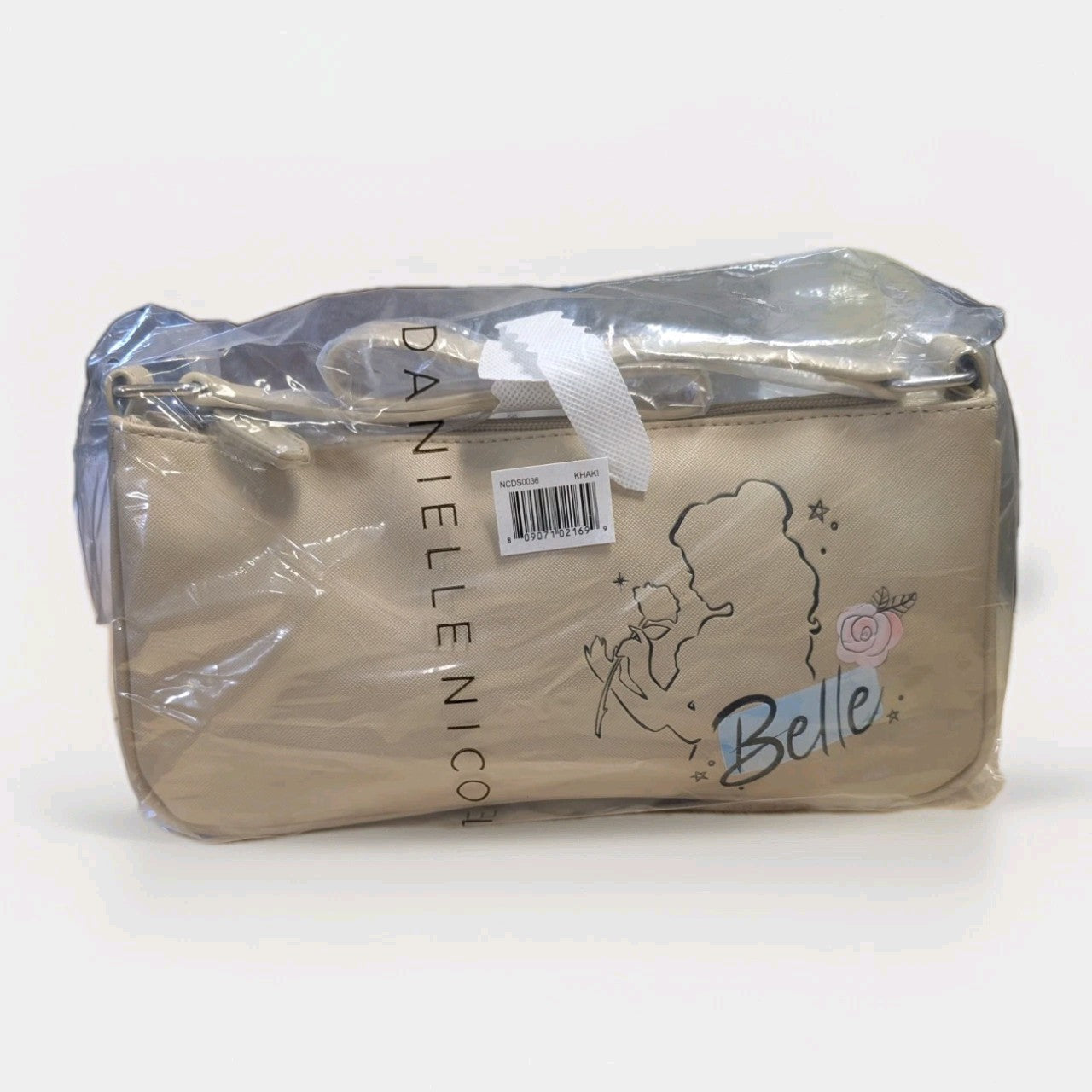 Danielle Nicole beige crossbody bag featuring Belle silhouette with rose and hand-lettered name in protective plastic wrap