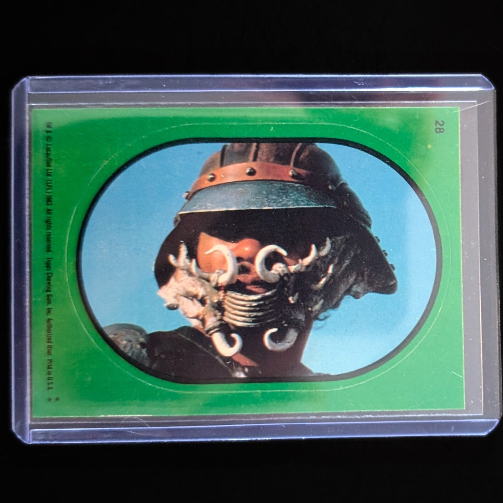 1983 Topps Return of the Jedi green border sticker featuring Star Wars character in protective sleeve by Go Figment