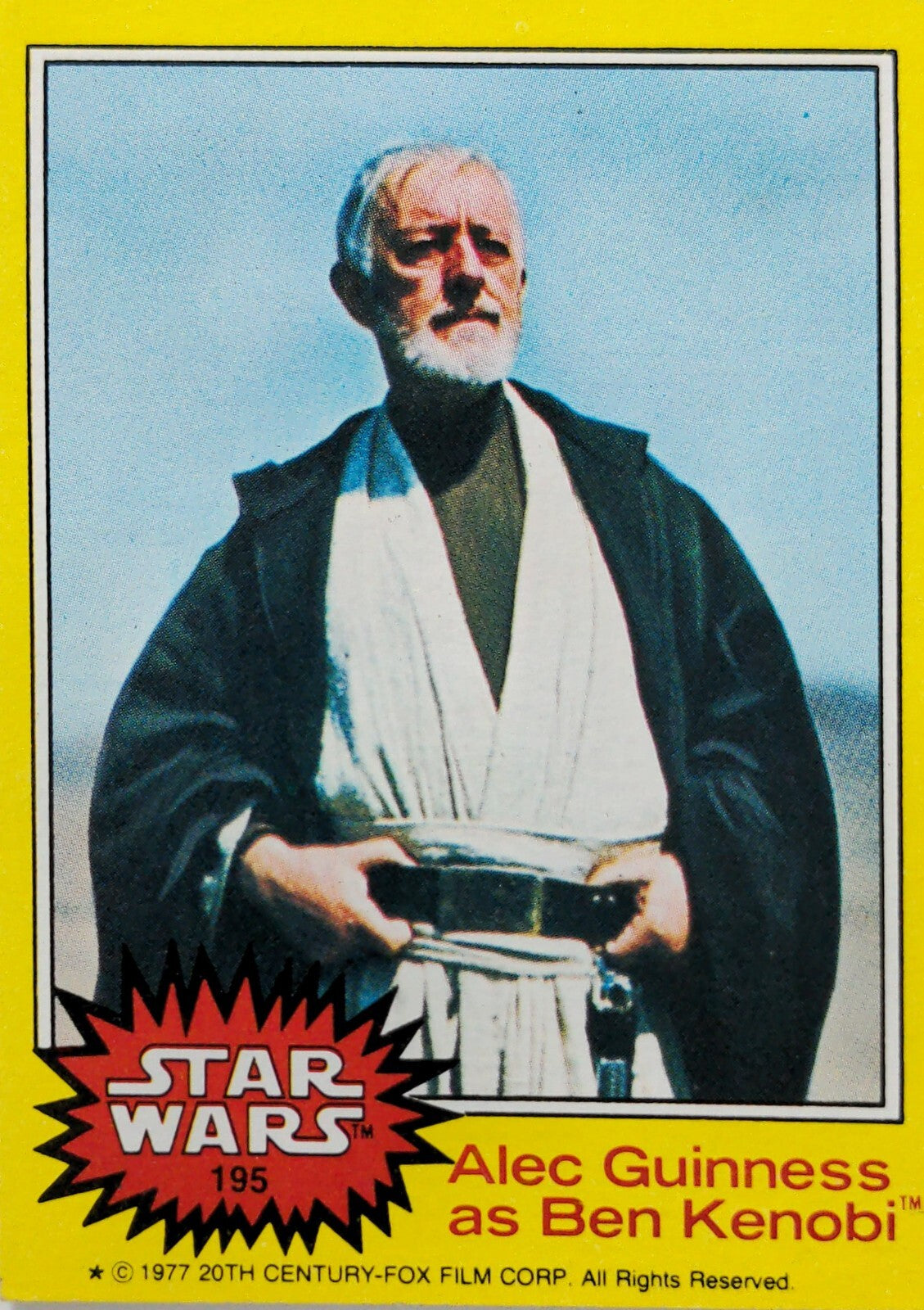 Vintage Star Wars trading card featuring Alec Guinness as Ben Kenobi with yellow border and red logo