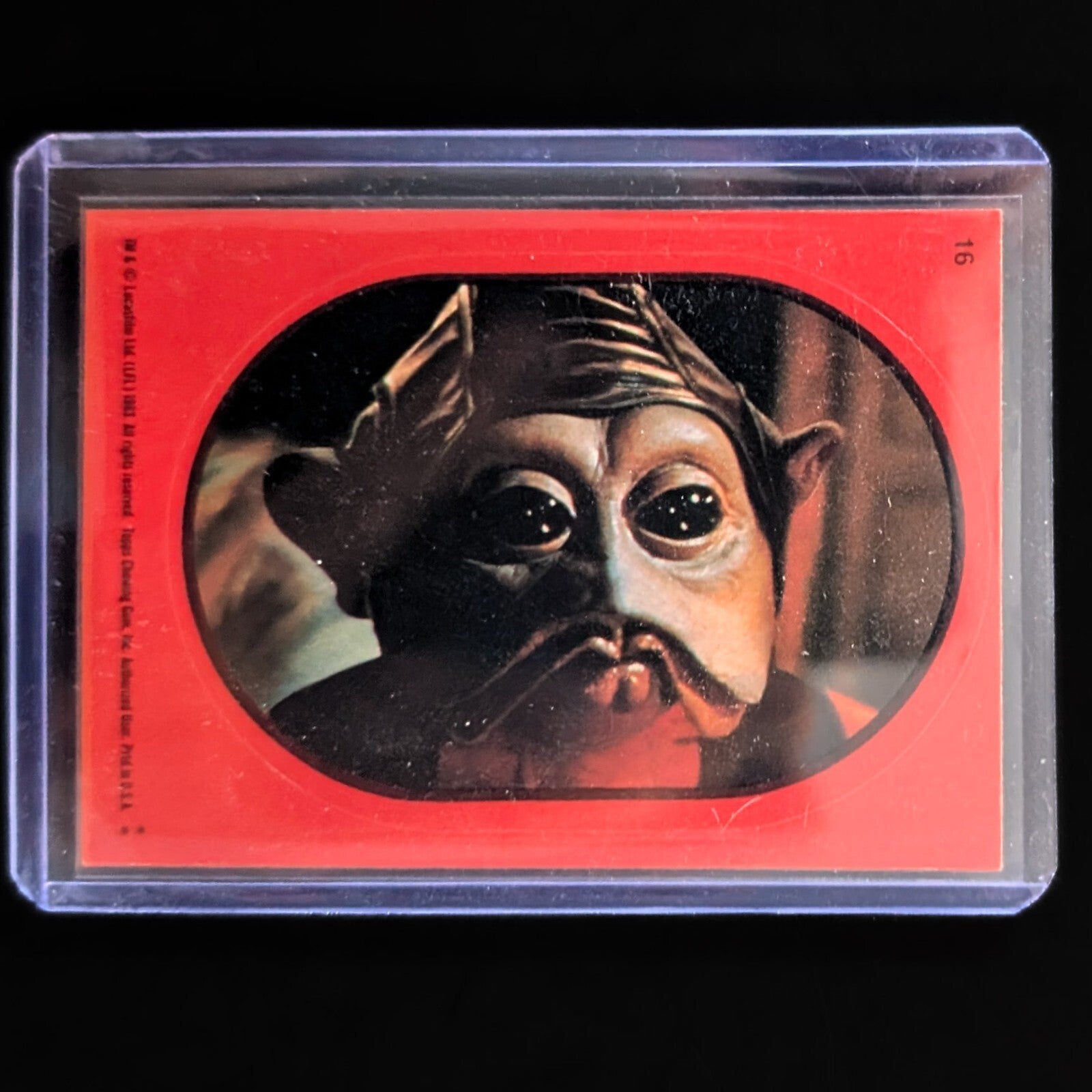 1983 Topps Return of the Jedi collectible sticker card featuring Star Wars character in protective sleeve by Go Figment
