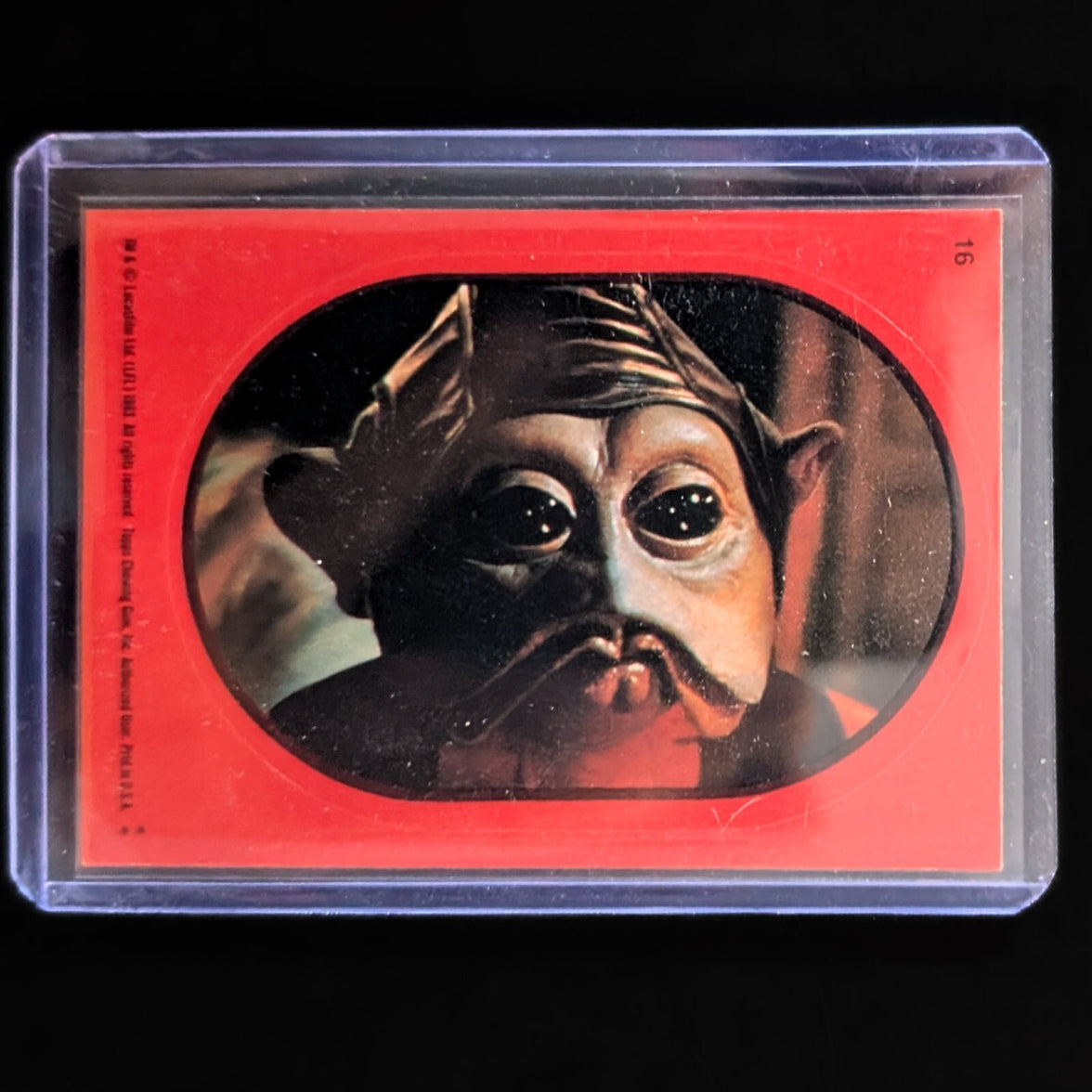 1983 Topps Return of the Jedi collectible sticker card featuring Star Wars character in protective sleeve by Go Figment