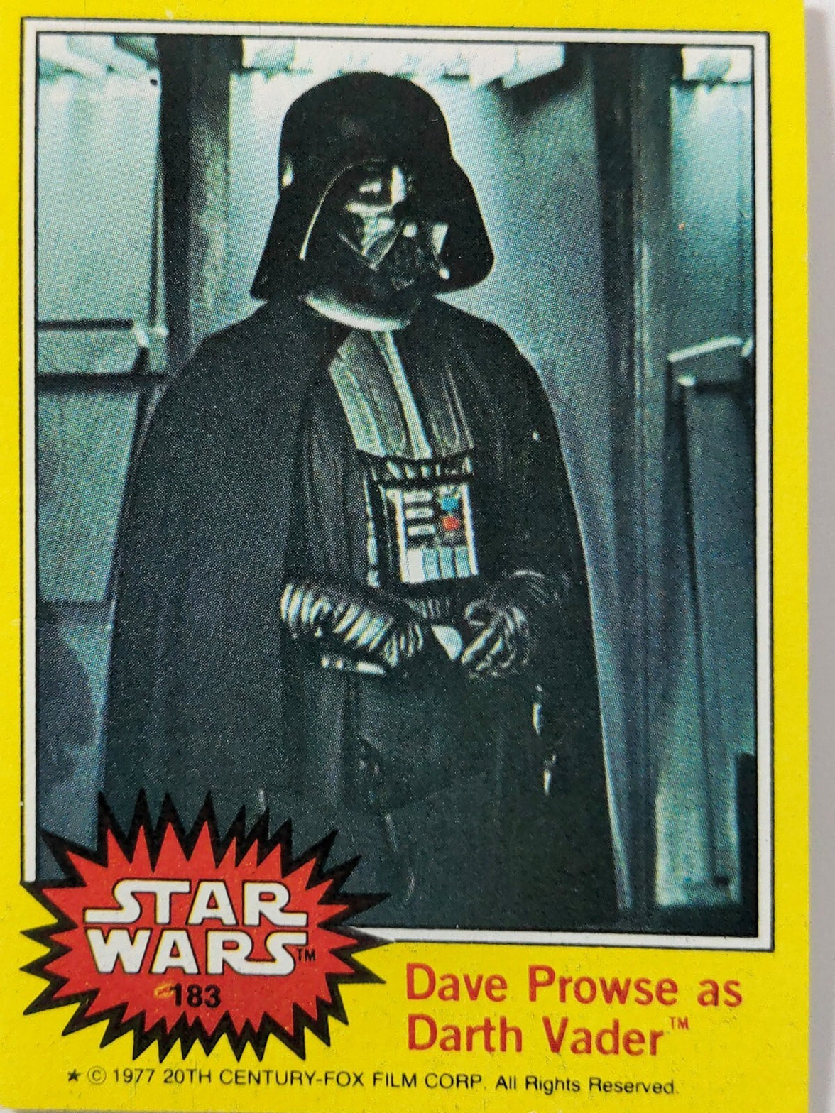 Vintage Star Wars trading card featuring Dave Prowse as Darth Vader with yellow border and copyright text