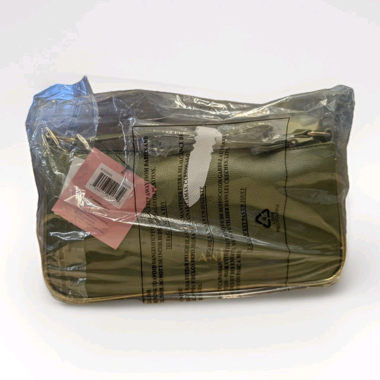 DANIELLE NICOLE green shoulder bag inspired by Disney Princess Tiana wrapped in protective plastic with visible tags