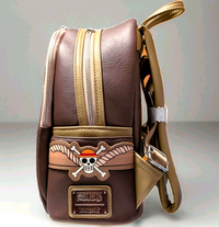 Loungefly mini backpack side view with Monkey D. Luffy pirate emblem on brown and tan faux leather materials