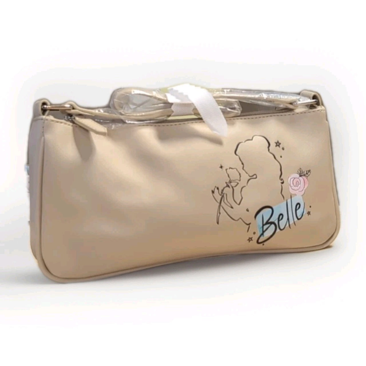 Danielle Nicole beige crossbody bag with Belle silhouette outline and floral detail on smooth finish satchel