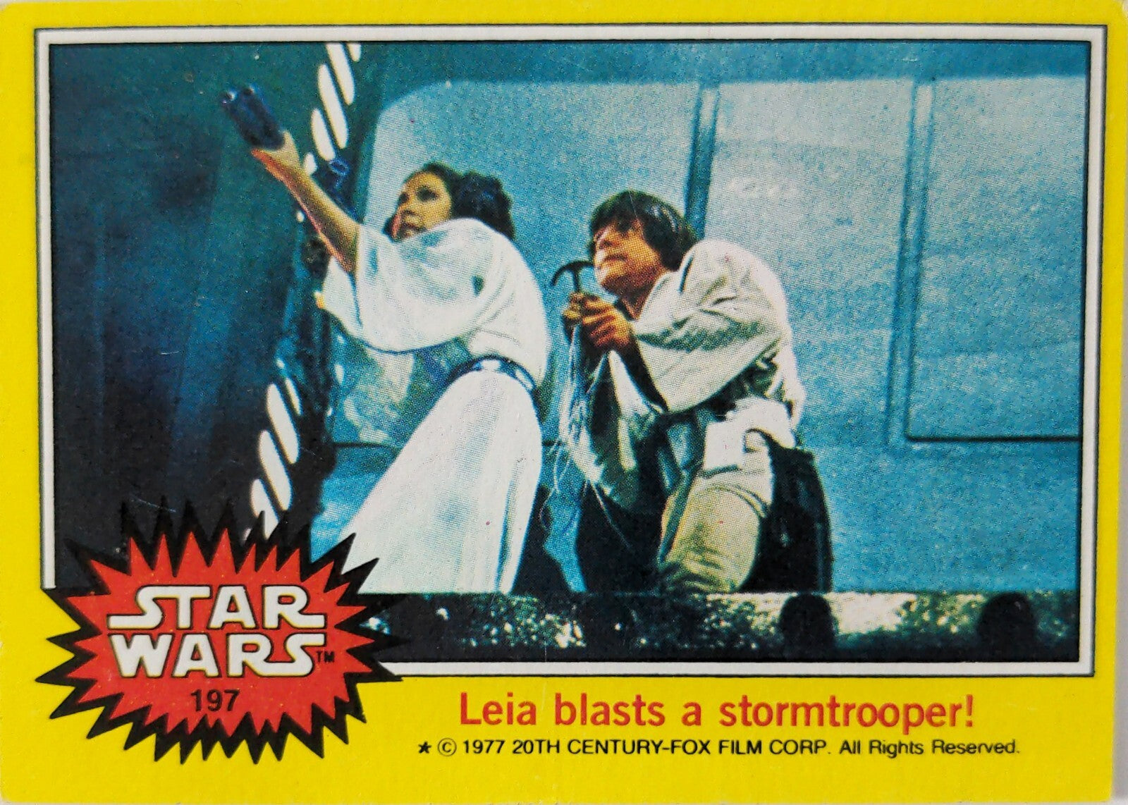 Vintage Star Wars trading card 197 featuring Leia blasting a stormtrooper with yellow border and red logo