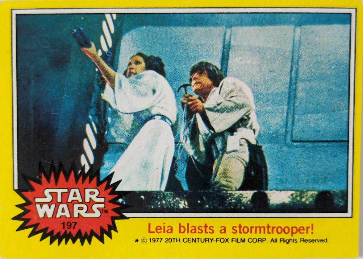 Vintage Star Wars trading card 197 featuring Leia blasting a stormtrooper with yellow border and red logo
