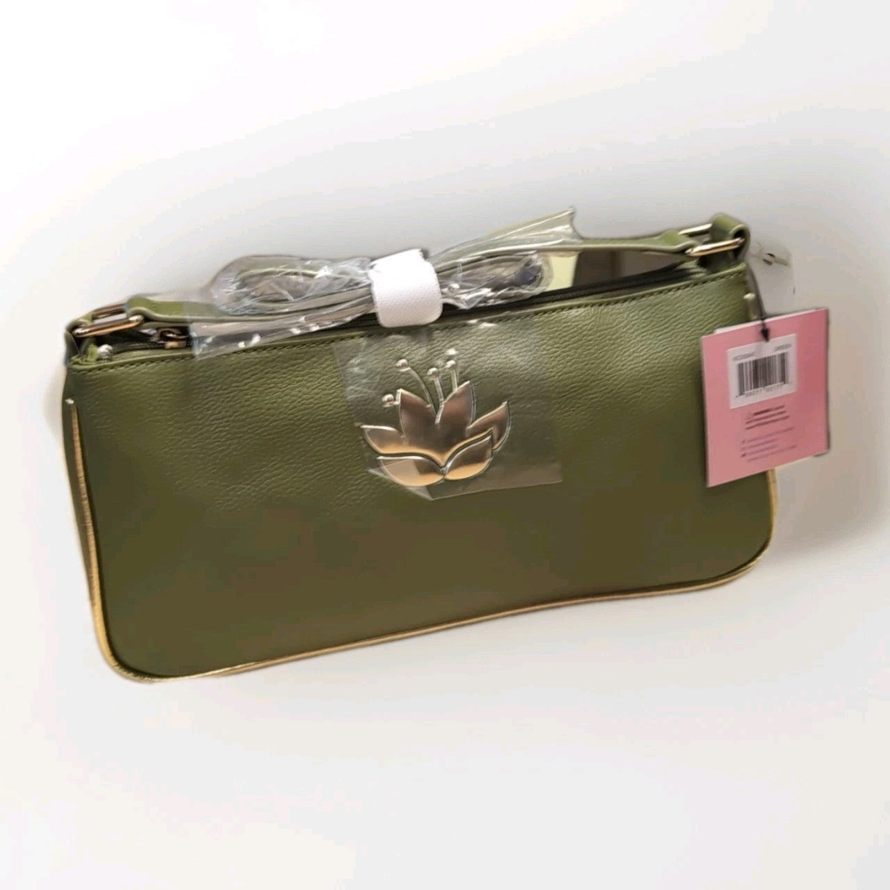 DANIELLE NICOLE green shoulder bag inspired by Tiana with lotus flower emblem and adjustable strap in packaging