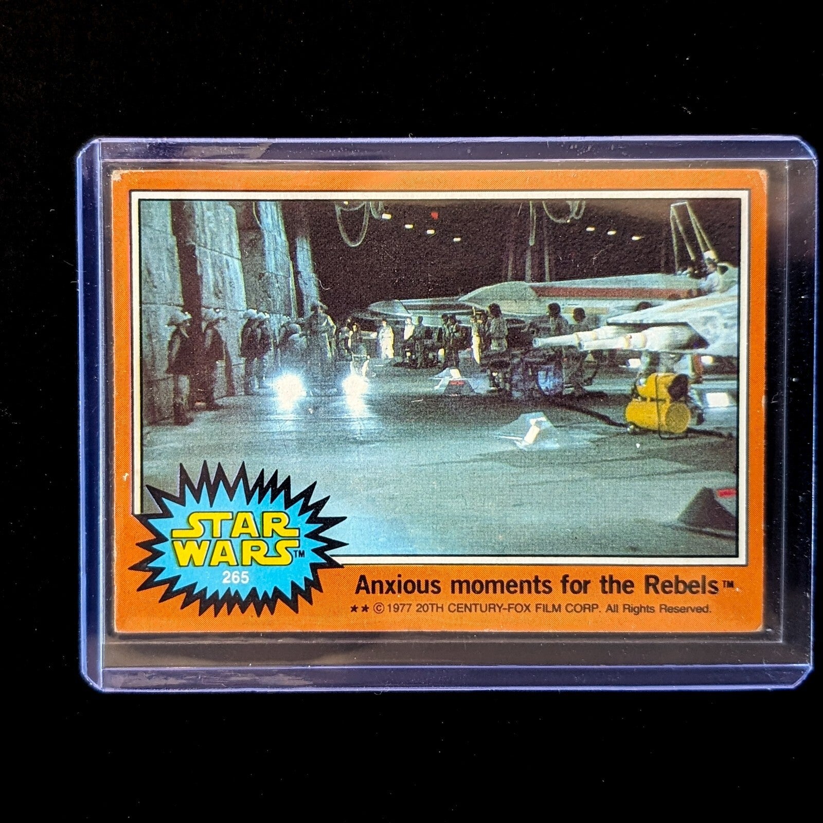 1977 Go Figment TOPPS Star Wars Orange Series 4 trading card featuring Rebel base scene in protective case