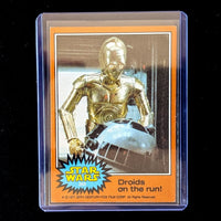 1977 Topps Star Wars orange Series 4 trading card featuring C-3PO and R2-D2 by Go Figment