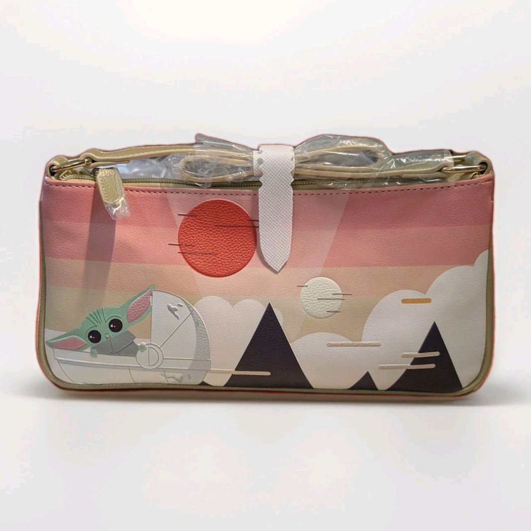 Danielle Nicole crossbody bag with Grogu holding a bow against stylized mountains and a red sun background