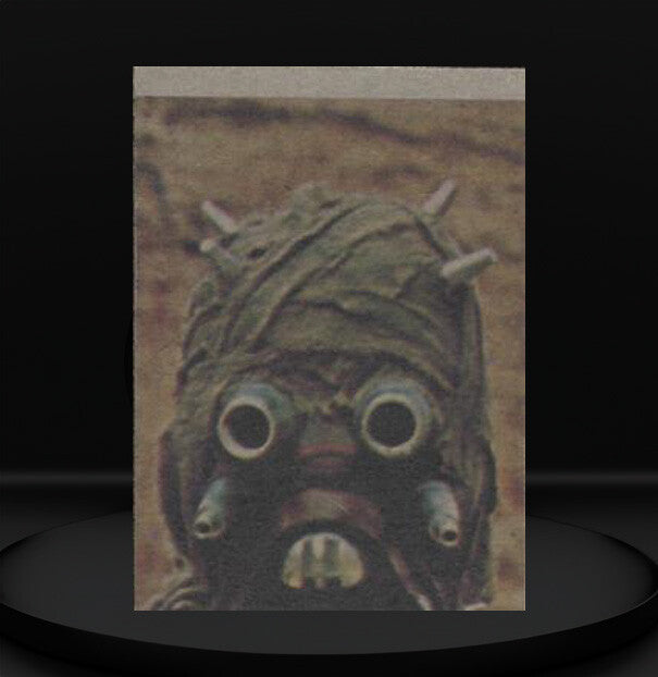 Close-up of vintage 1977 Topps Star Wars trading card featuring a Tusken Raider from Go Figment collection.