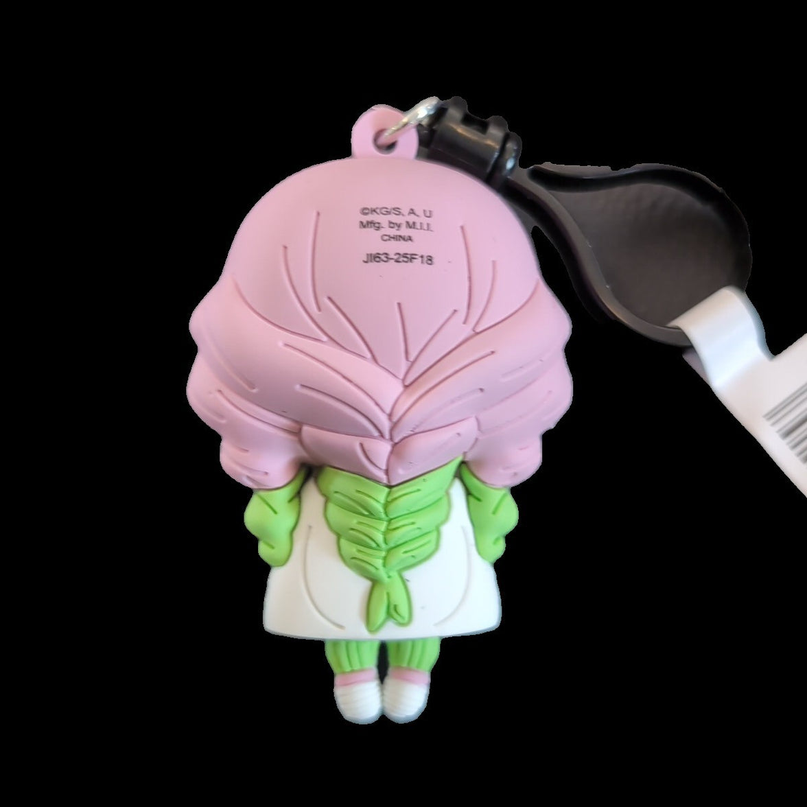 Back view of Monogram Kimetsu no Yaiba Demon Slayer character bag clip keychain with pink hair and green outfit