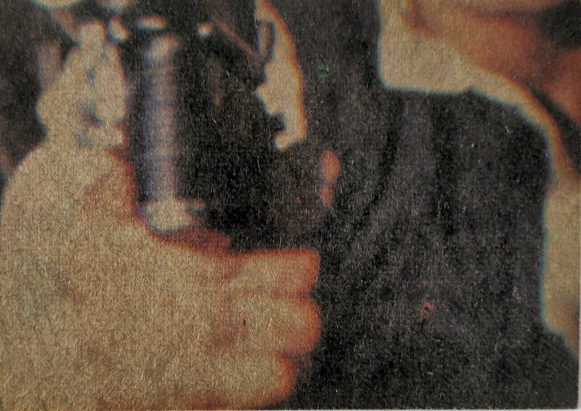 Close-up of a vintage 1977 Topps Star Wars trading card featuring a character holding a blaster, from Go Figment collection.