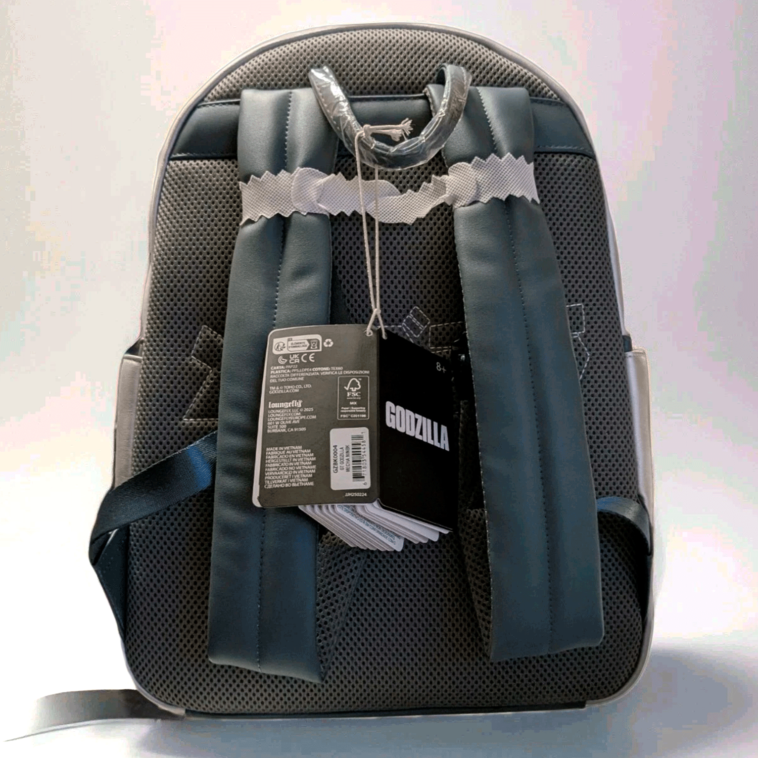 Back view of Loungefly full-size Godzilla Mechagodzilla backpack showing padded straps and attached product tags