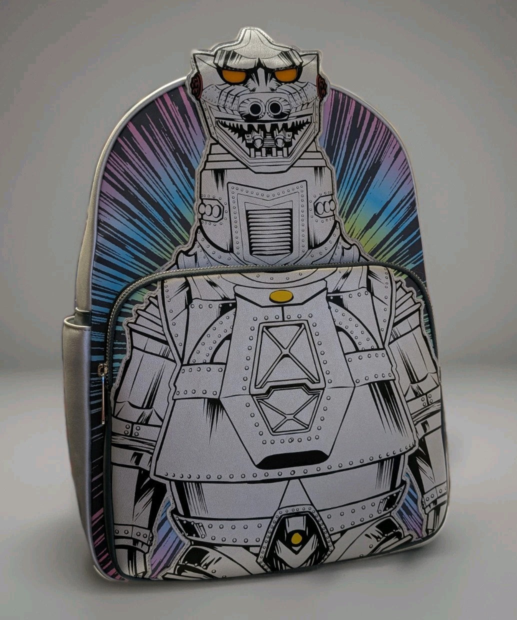 Loungefly full-size backpack with detailed Mechagodzilla graphic and colorful burst background on front pocket panel