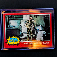 1977 Topps Star Wars trading card featuring C-3PO and R2-D2 titled The droids wait for Luke by Go Figment