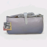 Danielle Nicole gradient purple baguette bag with subtle logo and white strap wrapped in protective plastic