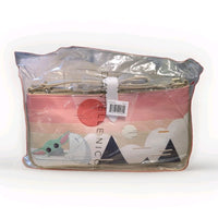 Danielle Nicole crossbody bag featuring Grogu in a stylized landscape with pink and beige tones in clear packaging