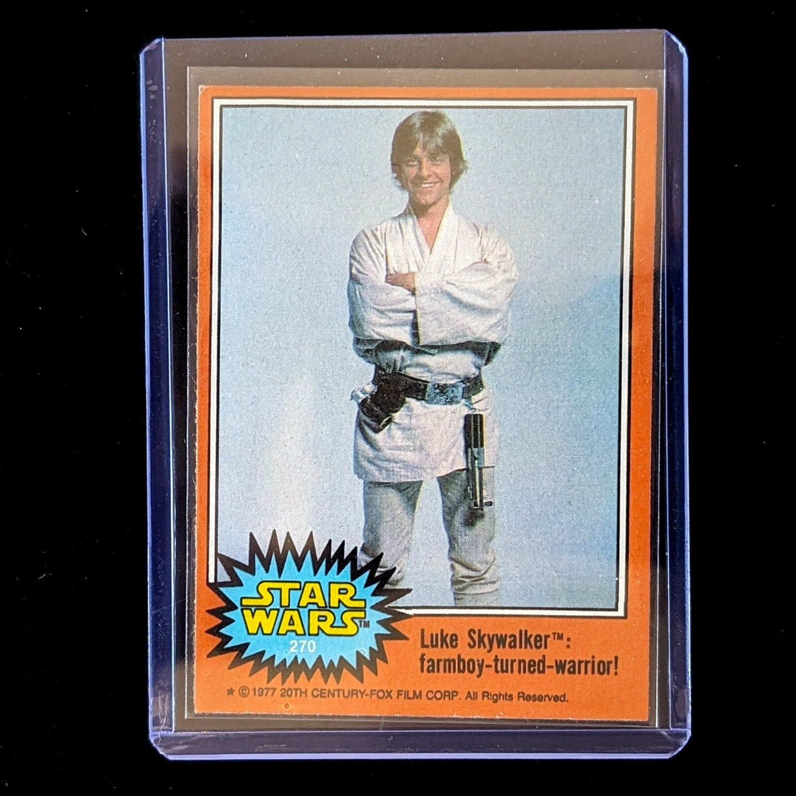 1977 Go Figment TOPPS Star Wars card featuring Luke Skywalker from Orange Series 4 in protective sleeve