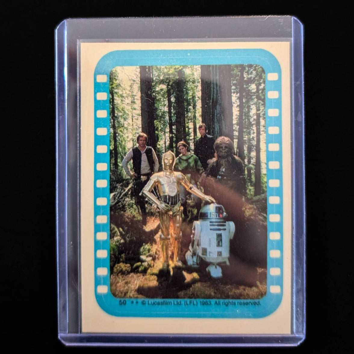 1983 Topps Return of the Jedi sticker featuring main characters in forest scene, vintage collectible from Go Figment