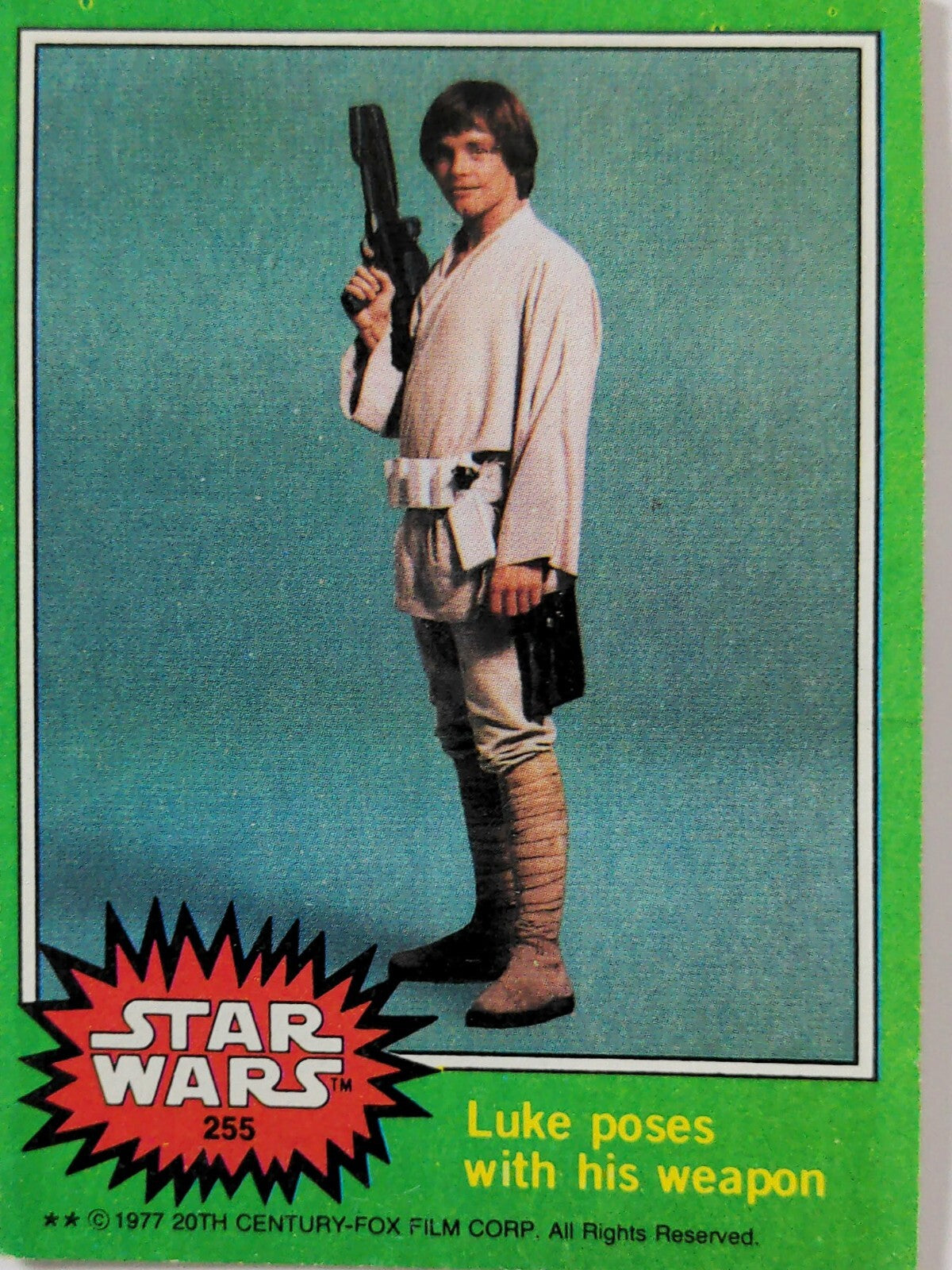1977 Go Figment Star Wars trading card of Luke Skywalker holding his weapon in vintage green series design