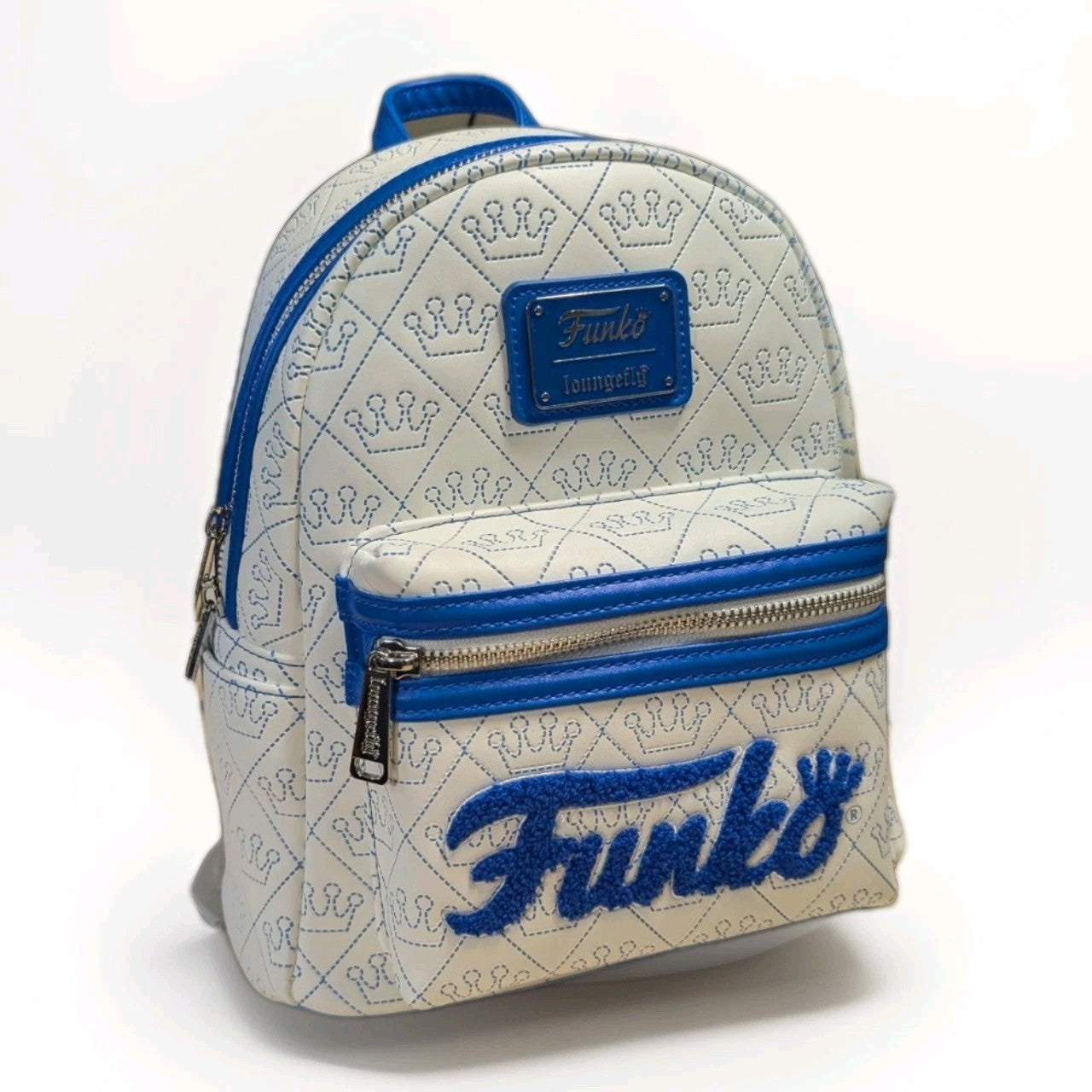 Loungefly mini backpack in white vegan leather with blue Funko logo patch and crown quilted pattern front pocket view