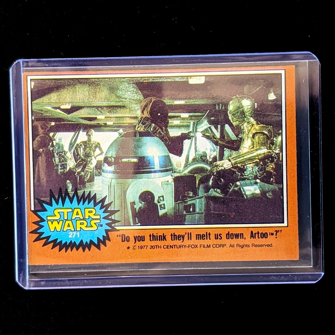 1977 Go Figment TOPPS Star Wars Orange Series 4 trading card featuring droids R2-D2 and C-3PO in a scene from the film