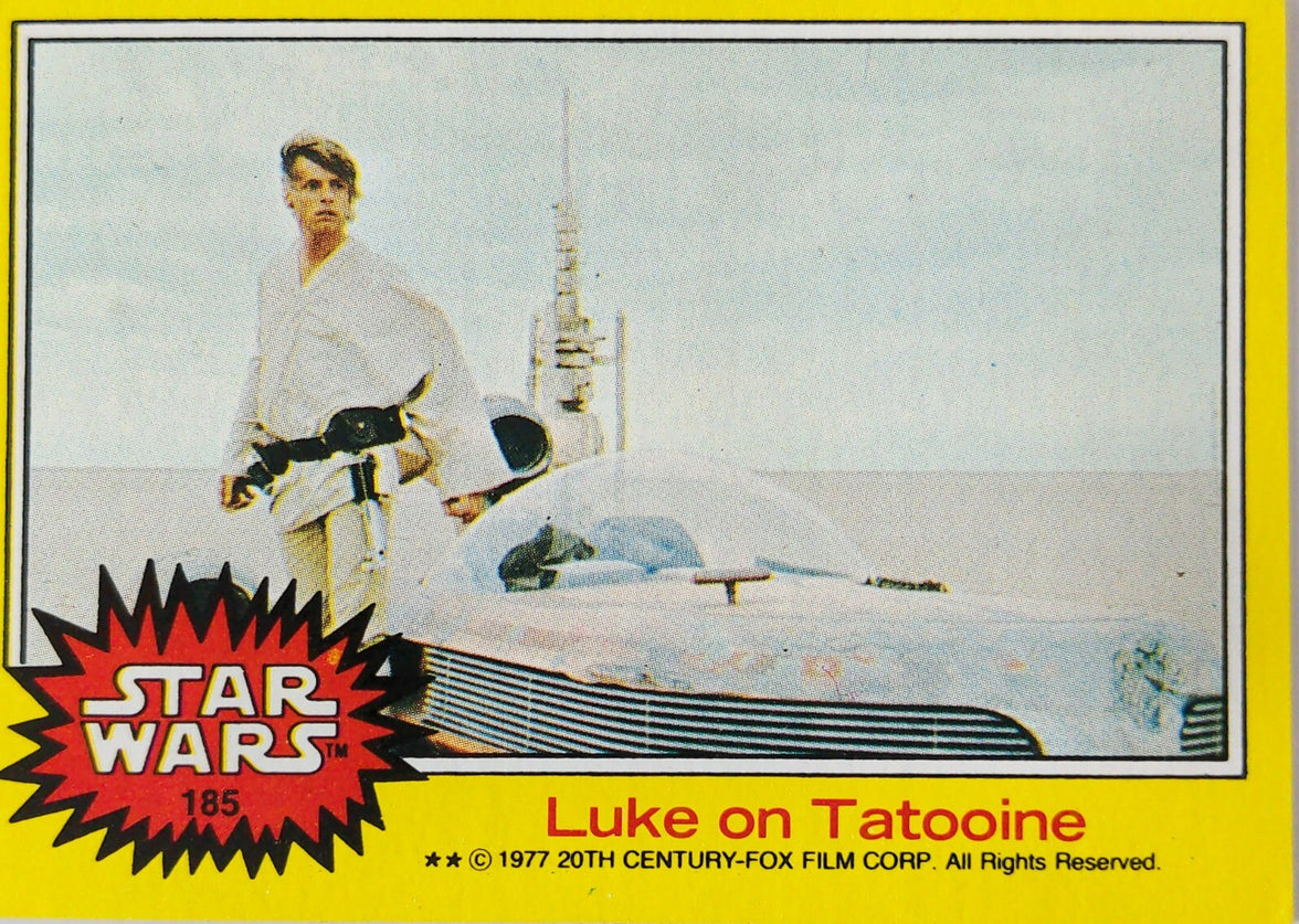 Vintage Star Wars trading card #185 featuring Luke Skywalker on Tatooine with landspeeder and desert background