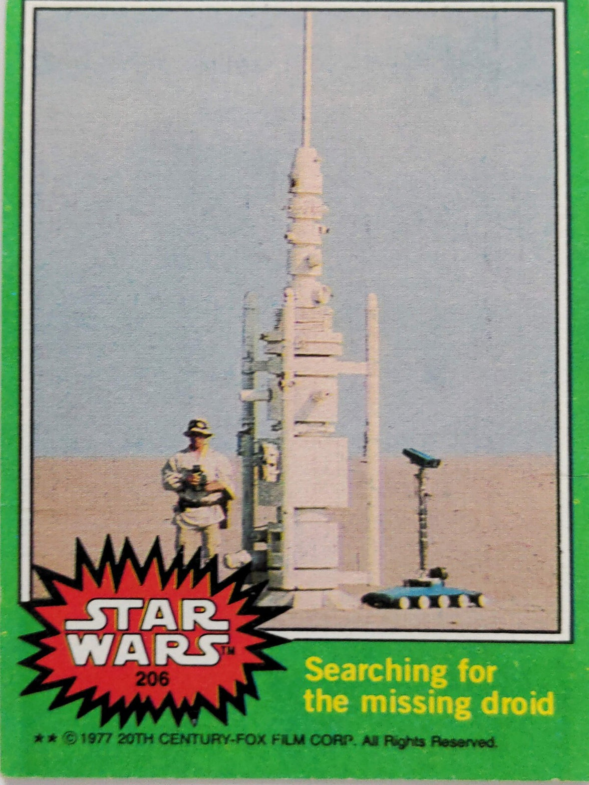 1977 Topps Star Wars card by Go Figment showing a figure searching for a missing droid near a tall structure