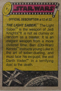 Vintage Star Wars card official description #12 detailing the Light Saber and key characters from the saga