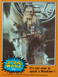 1977 Go Figment Star Wars trading card featuring Chewbacca with text warning not to upset a Wookiee in orange border