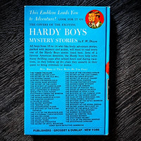 Vintage Hardy Boys book The Twisted Claw 1969 edition with distinctive blue cover and red accents by Grosset & Dunlap