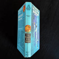 Vintage hardcover edition of The Clue of the Broken Blade, Hardy Boys Book 21 by Franklin W. Dixon published by Grosset & Dunlap