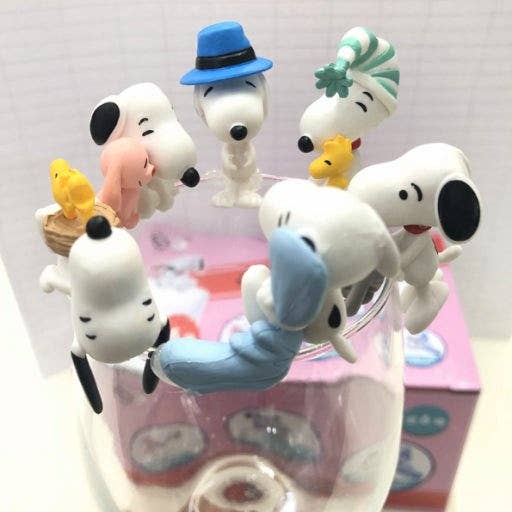 K-Wonderland Peanuts Snoopy cup figures blind box set showing various playful Snoopy poses perched on glass rim