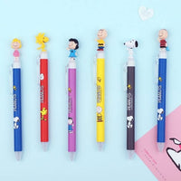 K-Wonderland Peanuts ballpoint pens in assorted colors with detailed Snoopy and Friends figure toppers on clear clip