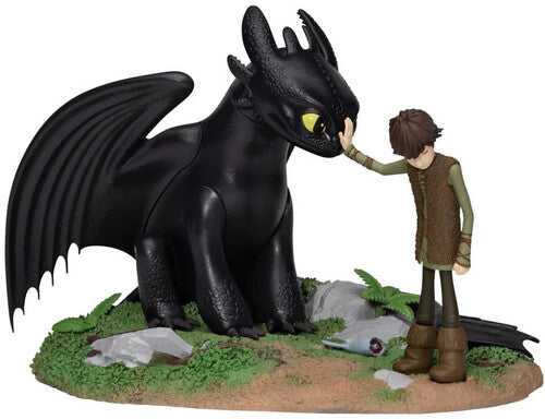 Beast Kingdom statue of Toothless and Hiccup sharing a moment on a detailed mossy base.