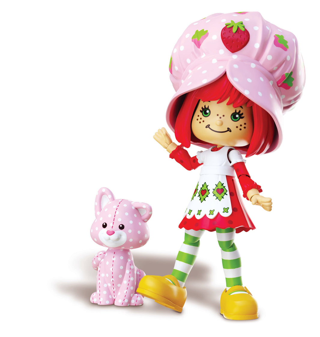Boss Fight Studio Llc Strawberry Shortcake figure with red hair, pink strawberry hat, red and white dress, striped leggings, and spotted kitten accessory