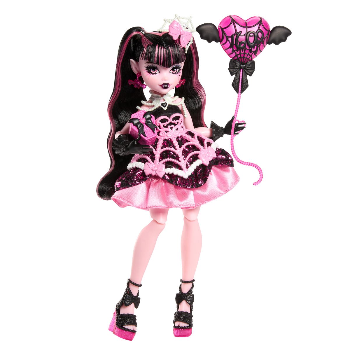 Mattel Monster High Draculaura doll in pink and black birthday dress holding bat-shaped balloon accessory