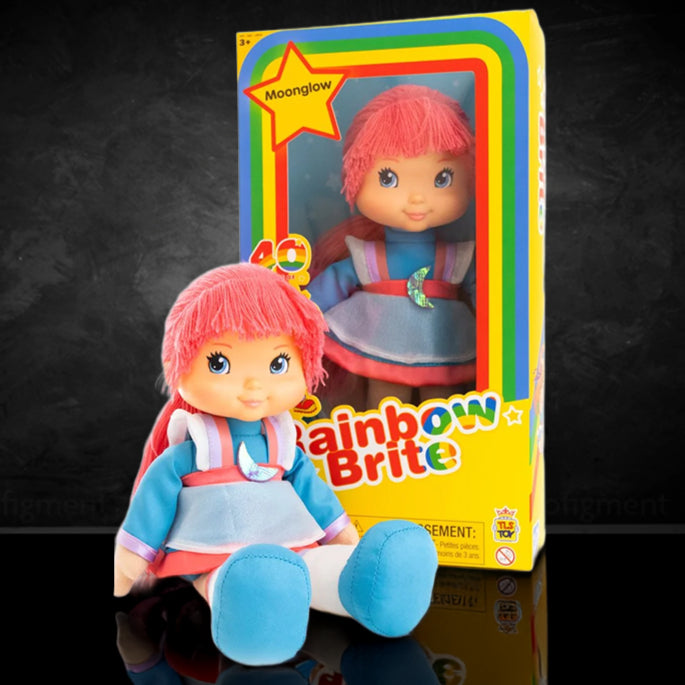 Rainbow Brite Moonglow 12-inch doll with pink hair and blue outfit next to colorful 40th Anniversary edition box by The Loyal Subjects