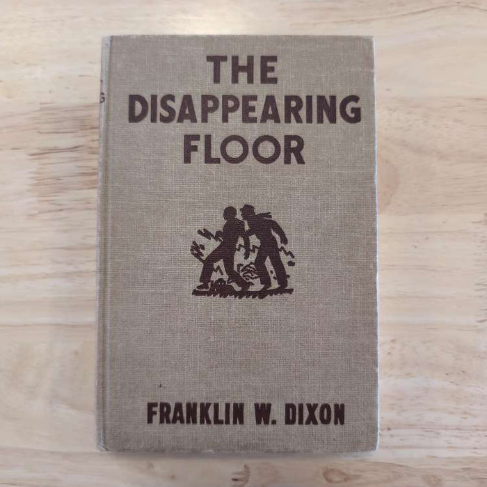 Vintage Hardy Boys book The Disappearing Floor with brown cover by Franklin W. Dixon from Grosset & Dunlap Inc.