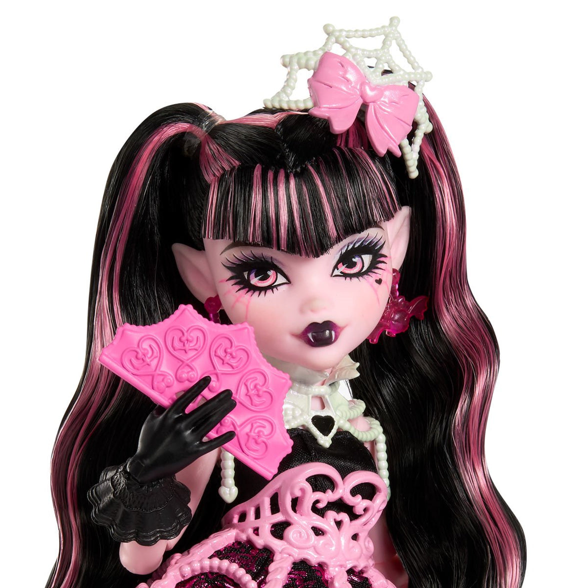 Mattel Monster High Draculaura doll with pink and black hair wearing party attire and holding pink birthday cards