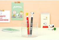 K-Wonderland Peanuts ballpoint pens in red and black featuring Snoopy and Woodstock figure toppers in clear holder