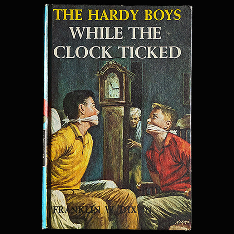 11 While the Clock Ticked (1962):  Vintage Hardy Boys Book Blue-Back image 0