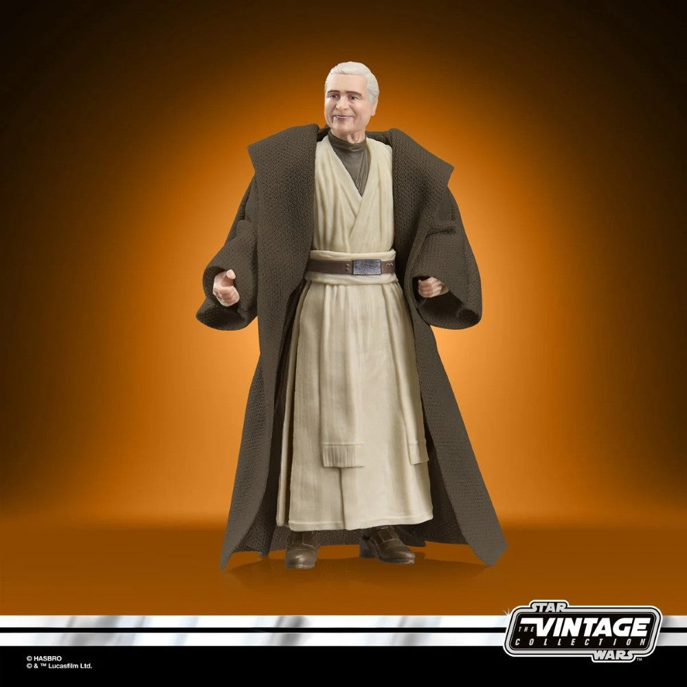 Star Wars Vintage Collection figure wearing beige robes and a brown cloak against an orange background